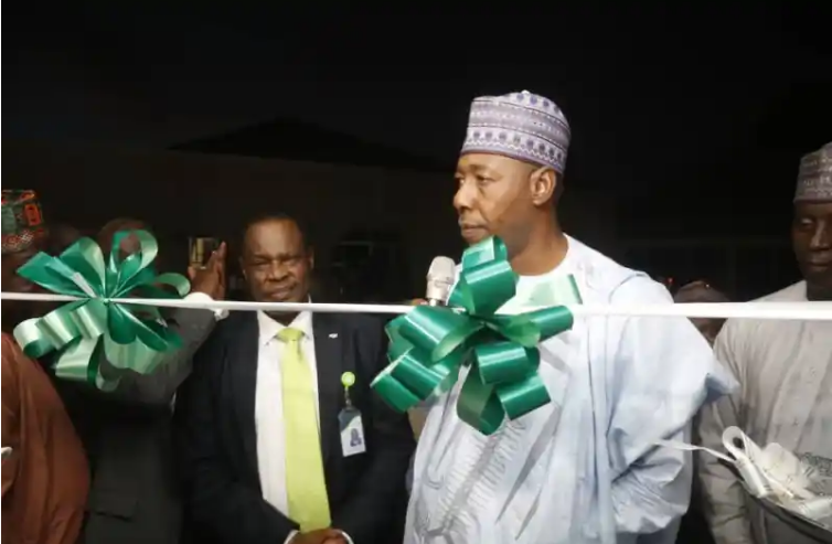 Governor Babagana Zulum commends Unity Bank before cutting the tape during the official commissioning of a building donated to Borno SUBEB by Unity Bank Plc.