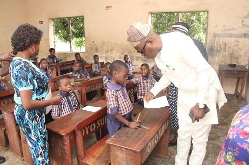 Dr. Adeniran at SDA Primary School, Old-Ife road during the monitoring exercise.