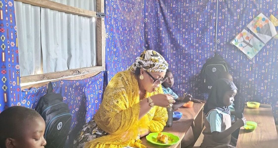 School Feeding: FG Targets Over 10 Million Children, Vows To Leave No Child Behind With Dr. Yetunde Adeniji with some of the children at Wassa