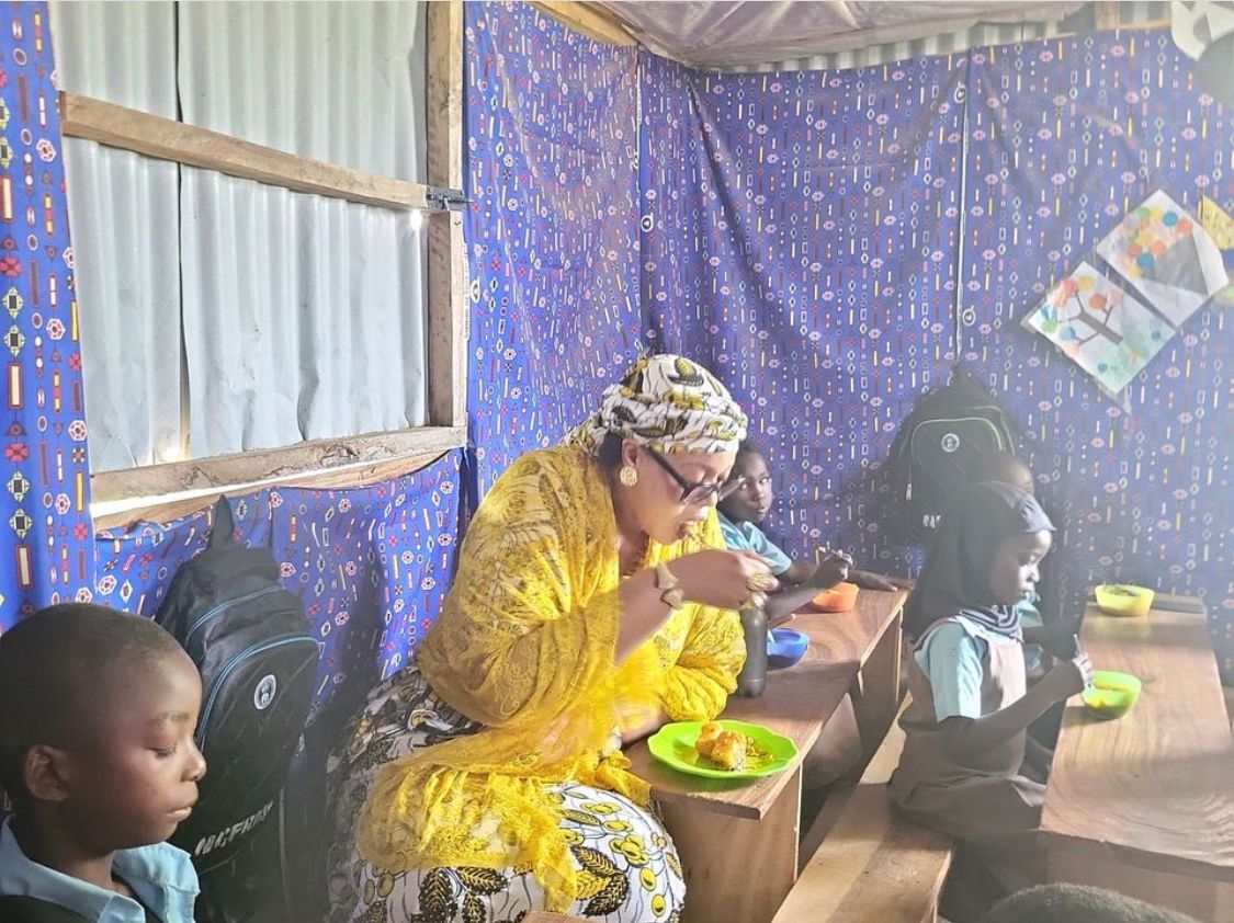 School Feeding: FG Targets Over 10 Million Children, Vows To Leave No Child Behind With Dr. Yetunde Adeniji with some of the children at Wassa