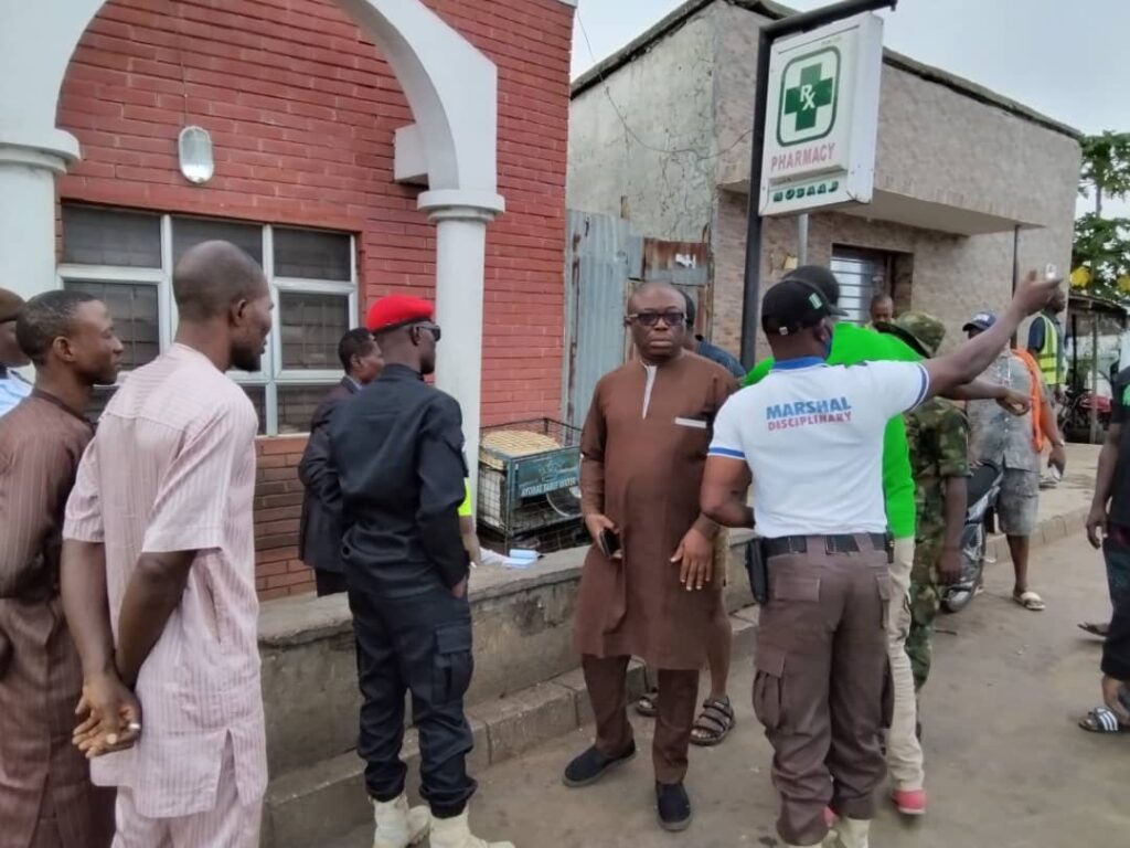 The Permanent Secretary, Ministry of Environment, Dr. Ayinla Abubakar listening to a Taskforce Officer, during the Sanitation exercise in Ilorin, over the weekend.