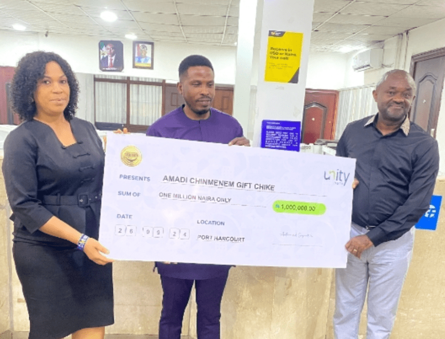 From left: Chioma Umeh, Unity Bank Branch Manager, Aba Road 1, Port Harcourt; Amadi Chinmenem Gift Chike, the grand prize winner, and Mr. Etop Ukpe, Unity Bank's Regional Manager, Port Harcourt/Uyo Region presening the N1M check to the winner