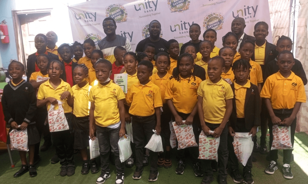 A cross section of some Unity Bank team with students of Ted Specular Schools, Barnawa Kaduna, Kaduna State after the training session.