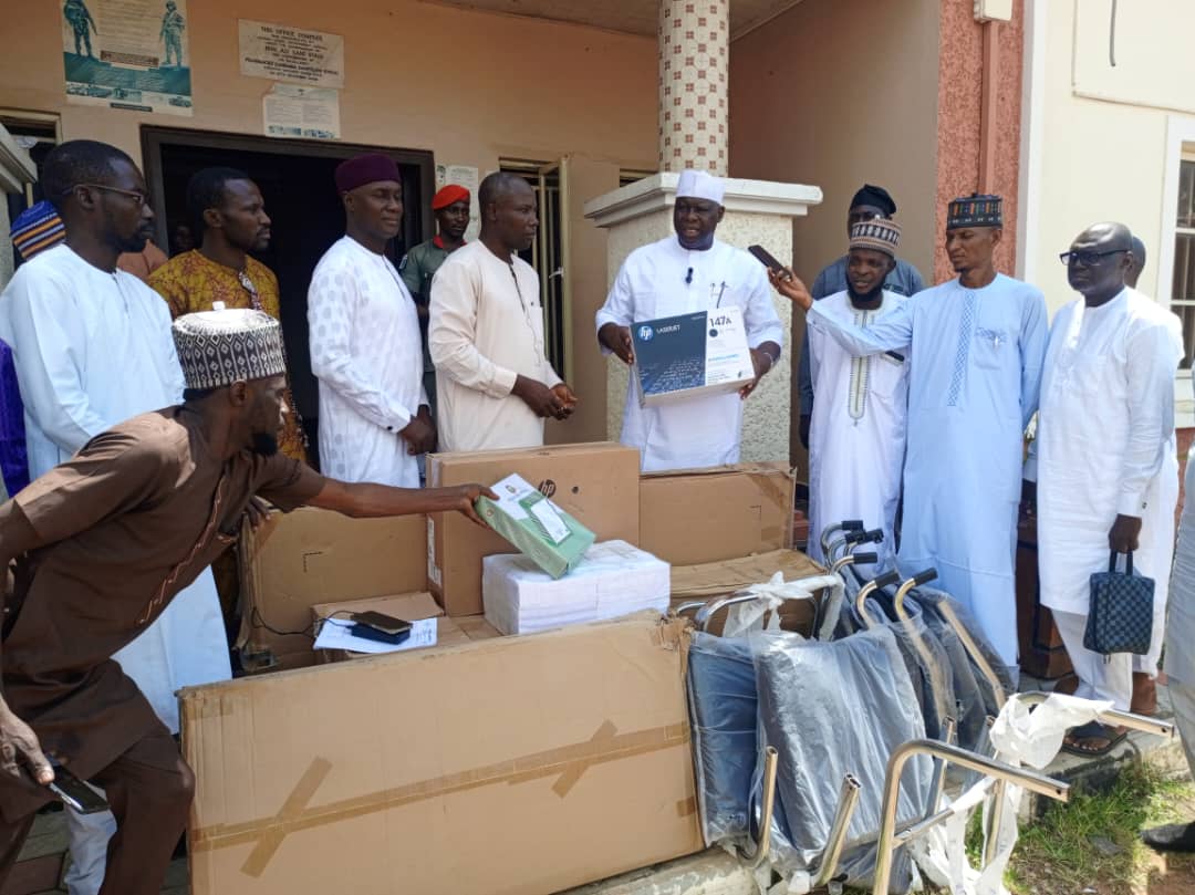 ALGON Chairman Taraba Hon Jauro Hassan 4th middle carrying one of the equipment for distribution during the event
